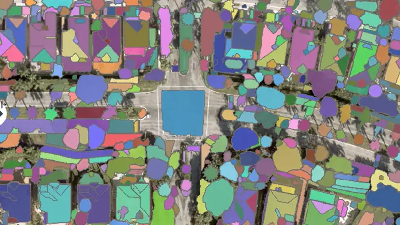 Aerial image with every building segmented in colour